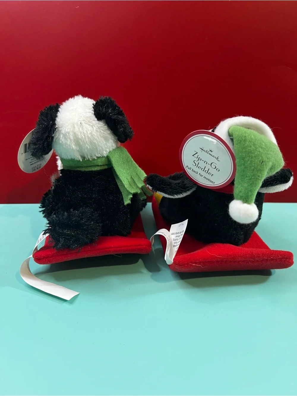 Hallmark Black & White Penguin with Red Scarf Plush Sledder